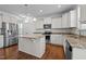 Stylish kitchen showcasing granite countertops, stainless steel appliances, and an island with pendant lighting at 3541 Fairstone Rd, Wake Forest, NC 27587