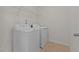 Laundry room with a side-by-side washer and dryer offers convenience at 3541 Fairstone Rd, Wake Forest, NC 27587