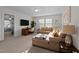 Comfortable living room with desk, L-shaped couch, carpeted floors and natural light coming in from the windows at 3541 Fairstone Rd, Wake Forest, NC 27587