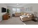Comfortable living room with desk, L-shaped couch, carpeted floors and light coming in from the windows at 3541 Fairstone Rd, Wake Forest, NC 27587