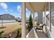 Inviting covered front porch with seating and landscaping, perfect for enjoying the outdoors at 3541 Fairstone Rd, Wake Forest, NC 27587