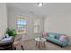 Cozy sitting room with natural light, comfortable seating, and a decorative center table at 3541 Fairstone Rd, Wake Forest, NC 27587