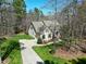 Aerial view of a home, driveway, and lush greenery at 3655 Pleasants Ridge Dr, Wake Forest, NC 27587