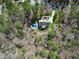Aerial view of a home, pool, driveway, and lush greenery at 3655 Pleasants Ridge Dr, Wake Forest, NC 27587