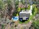 Aerial view of a home, pool, driveway, and lush greenery at 3655 Pleasants Ridge Dr, Wake Forest, NC 27587