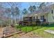 Spacious backyard with a deck, patio, and fencing, providing a secure and private outdoor space at 3655 Pleasants Ridge Dr, Wake Forest, NC 27587