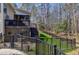 Home backyard features a deck with stairs and black metal fencing at 3655 Pleasants Ridge Dr, Wake Forest, NC 27587