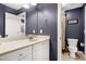 Stylish bathroom with a blue walls, a vanity, framed mirror, and a shower-tub combination at 3655 Pleasants Ridge Dr, Wake Forest, NC 27587