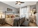 Inviting bedroom featuring a cozy bed, bedside table, sitting area, and a bright window at 3655 Pleasants Ridge Dr, Wake Forest, NC 27587