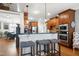 Charming kitchen with stainless appliances, a breakfast bar with seating, and wood cabinetry at 3655 Pleasants Ridge Dr, Wake Forest, NC 27587
