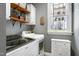 Neat laundry room with washer, dryer, shelving, window, and storage cabinet at 3655 Pleasants Ridge Dr, Wake Forest, NC 27587