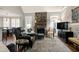 Cozy living area featuring a stone fireplace and comfortable seating arrangements at 3655 Pleasants Ridge Dr, Wake Forest, NC 27587