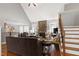 Open living room featuring fireplace, staircase, living area, and dining area at 3655 Pleasants Ridge Dr, Wake Forest, NC 27587