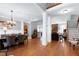 Open-concept living space featuring hardwood floors and access to dining and kitchen areas at 3655 Pleasants Ridge Dr, Wake Forest, NC 27587