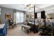 Comfortable main bedroom with a four-poster bed, sitting area, and gray walls at 3655 Pleasants Ridge Dr, Wake Forest, NC 27587