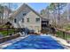 Home backyard features a pool with cover, deck, and lush greenery at 3655 Pleasants Ridge Dr, Wake Forest, NC 27587