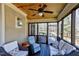 Comfortable screened porch with ceiling fan and wooded views, perfect for relaxing outdoors at 3655 Pleasants Ridge Dr, Wake Forest, NC 27587