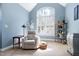 Cozy sitting area with natural light from large arched windows, comfortable seating, and stylish decorations at 3655 Pleasants Ridge Dr, Wake Forest, NC 27587