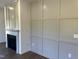 Living room showcasing a fireplace and modern paneled wall at 380 Pecan Valley Way, Four Oaks, NC 27524