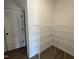 Walk-in closet equipped with wired shelving, ready for customization at 380 Pecan Valley Way, Four Oaks, NC 27524