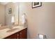 Bathroom with a vanity, mirror, and toilet, offering a clean and functional space at 4020 Abbey Park Way, Raleigh, NC 27612
