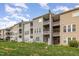 Townhome features multi-level balconies and a well-maintained lawn with a private backyard area at 4020 Abbey Park Way, Raleigh, NC 27612