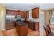 Gourmet kitchen features stainless steel appliances, granite countertops, central island, and custom cabinetry at 4020 Abbey Park Way, Raleigh, NC 27612