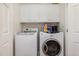 Bright laundry room features a washer, dryer, white cabinets, and a clean, functional space at 4020 Abbey Park Way, Raleigh, NC 27612