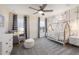 Cozy Bedroom with neutral tones, whimsical decor, and a comfortable rocking chair at 408 Providence Spring Ln, Fuquay Varina, NC 27526
