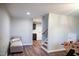 Spacious finished basement offers recreation space, seating, and walk-up steps to the first floor laundry room at 48 Blue Heron Ln, Roxboro, NC 27574