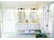 This bathroom features a double vanity, plenty of natural light, and modern fixtures at 48 Blue Heron Ln, Roxboro, NC 27574