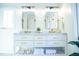 Bright bathroom with double sink vanity, marble countertop, and stylish gold fixtures at 48 Blue Heron Ln, Roxboro, NC 27574
