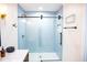Bathroom featuring a glass enclosed shower with light blue tile and a light colored floor at 48 Blue Heron Ln, Roxboro, NC 27574