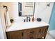 Bathroom featuring a wooden vanity with a marble countertop and matte black fixtures at 48 Blue Heron Ln, Roxboro, NC 27574