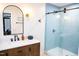 Bathroom featuring a glass enclosed shower with light blue tile at 48 Blue Heron Ln, Roxboro, NC 27574