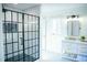 Bright bathroom showcasing a glass-enclosed shower, modern fixtures, and plenty of storage at 48 Blue Heron Ln, Roxboro, NC 27574