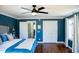 Comfortable bedroom features hardwood floors, white trim, and a ceiling fan at 48 Blue Heron Ln, Roxboro, NC 27574