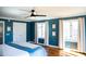 Comfortable bedroom features hardwood floors, white trim, and a ceiling fan at 48 Blue Heron Ln, Roxboro, NC 27574