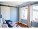 Bright bedroom with a barn door, hardwood floors, and natural light at 48 Blue Heron Ln, Roxboro, NC 27574