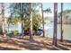 Picturesque boat dock nestled amidst trees along the serene lake shoreline at 48 Blue Heron Ln, Roxboro, NC 27574