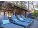 Relaxing boathouse deck with lounge chairs and view of the lake, perfect for waterfront living at 48 Blue Heron Ln, Roxboro, NC 27574