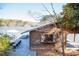 Charming boathouse with lakeside views, decorative windows, and a spacious deck at 48 Blue Heron Ln, Roxboro, NC 27574
