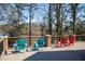 Home's deck offers a beautiful view of the lake with space for relaxing in the provided chairs at 48 Blue Heron Ln, Roxboro, NC 27574