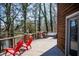 Cozy deck featuring outdoor seating and serene views of the surrounding lake and trees at 48 Blue Heron Ln, Roxboro, NC 27574