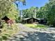 Charming single-story home with covered parking and well-manicured lawn at 48 Blue Heron Ln, Roxboro, NC 27574