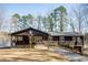 Beautiful home with a carport, surrounded by lush greenery and a well-kept driveway at 48 Blue Heron Ln, Roxboro, NC 27574
