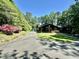Charming home with a well-manicured lawn and mature trees, offering a serene residential setting at 48 Blue Heron Ln, Roxboro, NC 27574