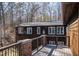 An exterior shot shows the home's deck and the windows on the rear of the house at 48 Blue Heron Ln, Roxboro, NC 27574