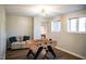 Finished game room with a foosball table, light colored couch, and two windows at 48 Blue Heron Ln, Roxboro, NC 27574