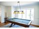 Game room featuring a classic pool table with overhead lighting and surrounding trim at 48 Blue Heron Ln, Roxboro, NC 27574